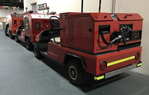 A red vehicle with a large box Description automatically generated with medium confidence