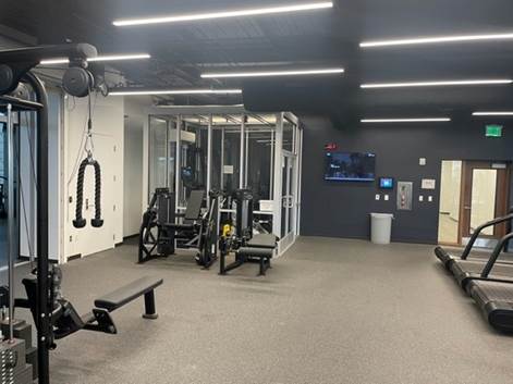 A gym with exercise equipment

Description automatically generated with medium confidence