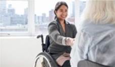 A person in a wheelchair talking to a person in a wheelchair

Description automatically generated with low confidence